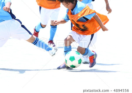 Soccer boys dodge defense by dribbling Soccer boys dodge defense by dribbling 4894556