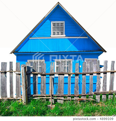 old wooden fence against blue building old wooden fence against blue building 4899109
