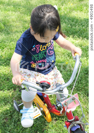 Children riding a bicycle Children riding a bicycle 4901498