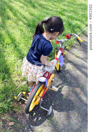 Children riding a bicycle 4901502