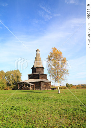 wooden chapel on green field 4903349