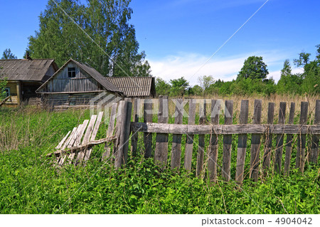 old fence near rural wooden building old fence near rural wooden building 4904042
