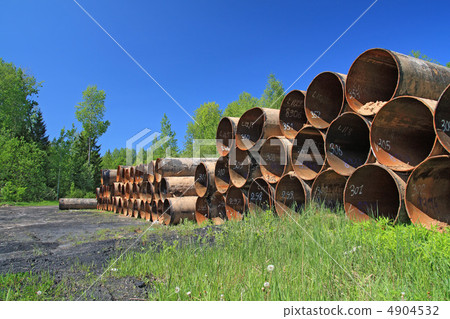 old gas pipes amongst green herb 4904532