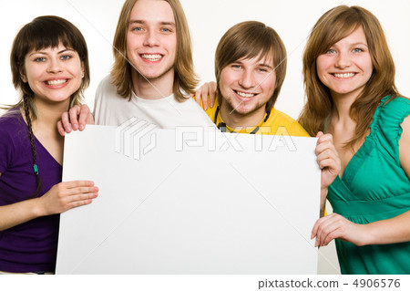 Four teenagers with a poster in front 4906576