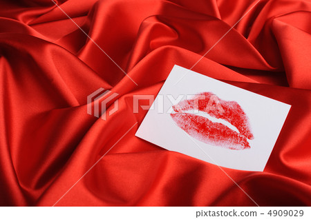 Note on red silk. A print of lips Note on red silk. A print of lips 4909029