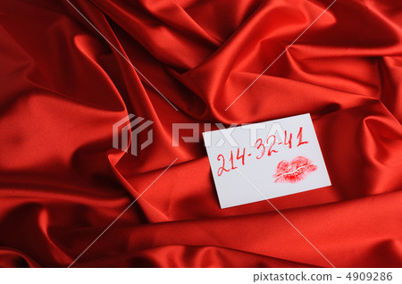 Note on red silk. With an invented phone number and a print of l Note on red silk. With an invented phone number and a print of l 4909286