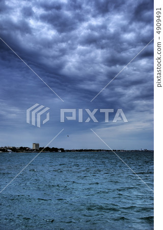 Fantastic clouds above ocean 4909491