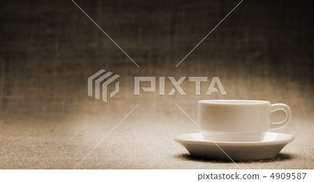 White cup on grunge a background White cup on grunge a background 4909587