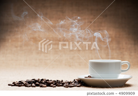 Cup of hot coffee about the ferry and grains of coffee on grunge Cup of hot coffee about the ferry and grains of coffee on grunge 4909909