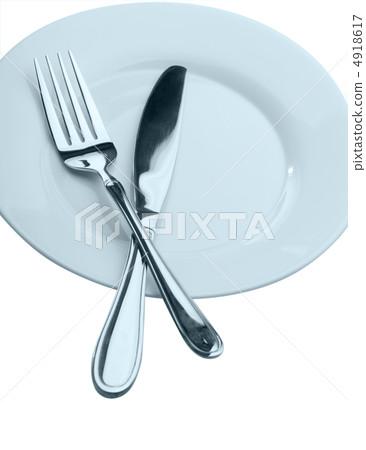 Knife and fork on a plate Knife and fork on a plate 4918617