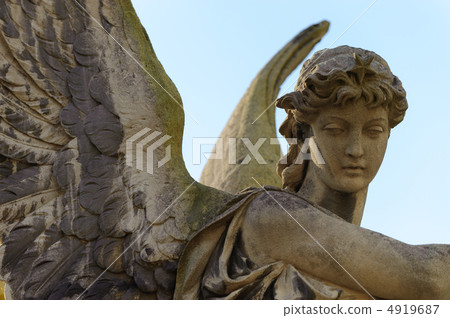 Monument to an angel on a cemetery Monument to an angel on a cemetery 4919687