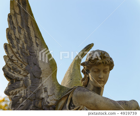 Monument to an angel on a cemetery Monument to an angel on a cemetery 4919739