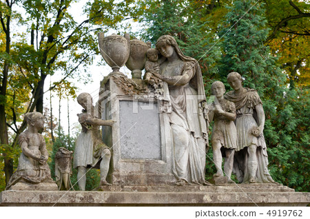 Tombstone family on a cemetery 4919762