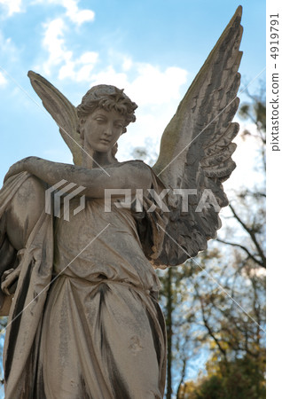 Monument to an angel on a cemetery Monument to an angel on a cemetery 4919791