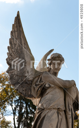 Monument to an angel on a cemetery Monument to an angel on a cemetery 4919808
