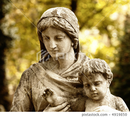 Monument of the woman with the child on a cemetery 4919850