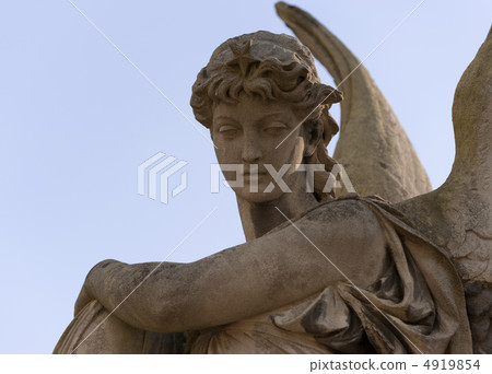 Monument to an angel on a cemetery Monument to an angel on a cemetery 4919854