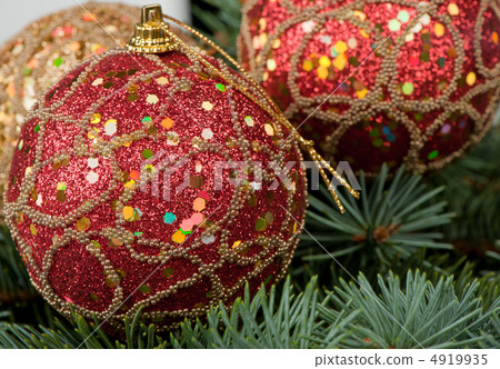 Christmas toys on branches of a fur-tree Christmas toys on branches of a fur-tree 4919935