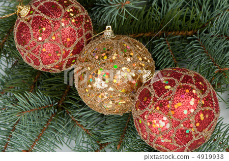 Christmas toys on branches of a fur-tree 4919938