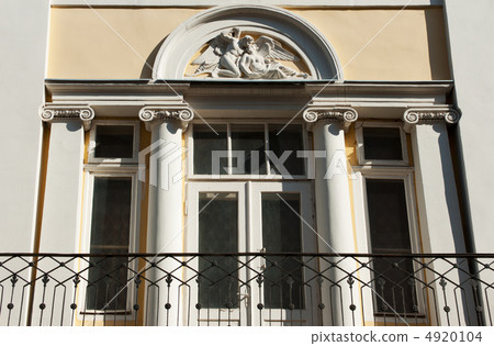 Facade of a building with a balcony. Facade of a building with a balcony. 4920104