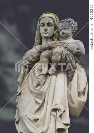 Monument of the woman with the child on a cemetery 4920292