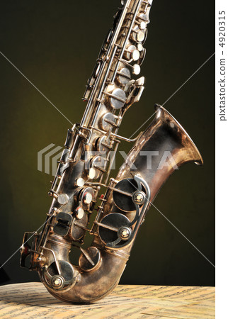 Old saxophone and notes Old saxophone and notes 4920315