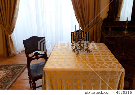 Ancient room with a table and a chair Ancient room with a table and a chair 4920316