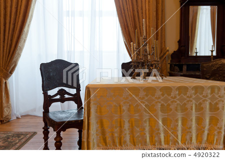 Ancient room with a table and a chair Ancient room with a table and a chair 4920322