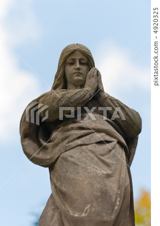 Monument Lady of Guadalupe on a cemetery 4920325