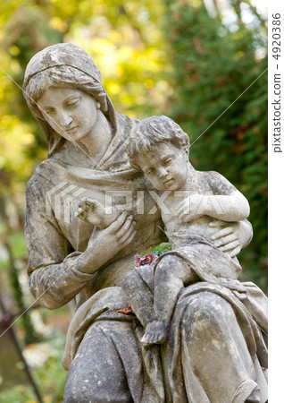Monument of the woman with the child on a cemetery Monument of the woman with the child on a cemetery 4920386