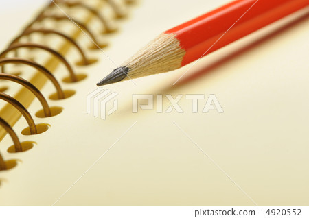 Notebook yellow paper and red pencil Notebook yellow paper and red pencil 4920552