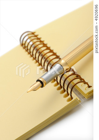 Fountain pen on a yellow notebook Fountain pen on a yellow notebook 4920696