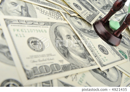 Sand-glass on dollars blue tone Sand-glass on dollars blue tone 4921435