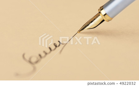 The signature close up and fountain pen. Old yellow paper 4922032