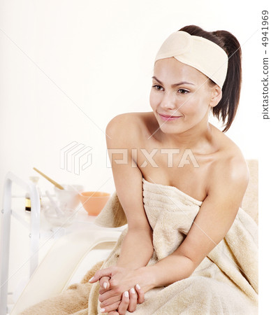 Young woman on massage table in beauty spa. 4941969