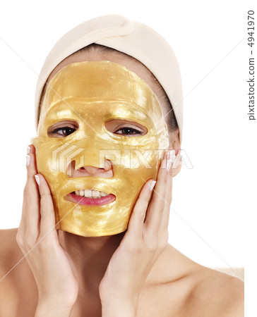 Girl with gold facial mask. 4941970