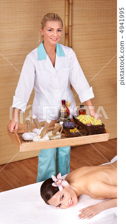 Young woman on massage table in beauty spa. Young woman on massage table in beauty spa. 4941995