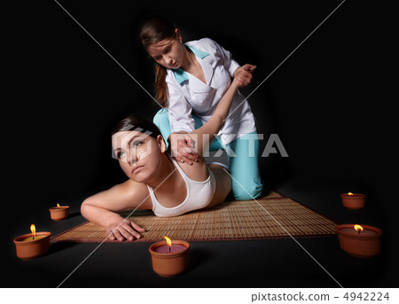 Beautiful girl having thai massage. Beautiful girl having thai massage. 4942224