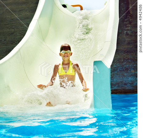 Child on water slide at aquapark. 4942486
