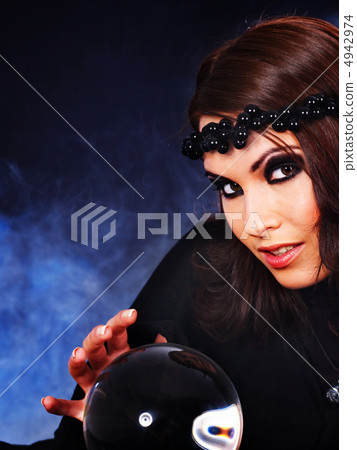 Young woman with crystal ball. Young woman with crystal ball. 4942974