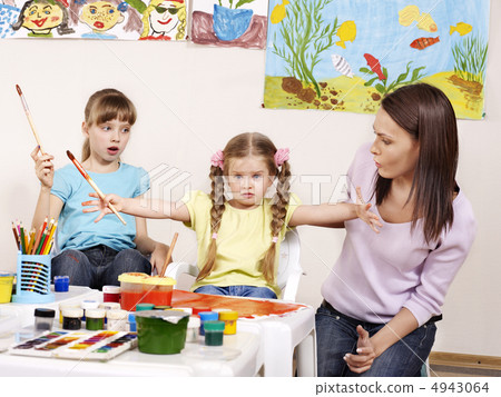 Child painting in preschool. 4943064