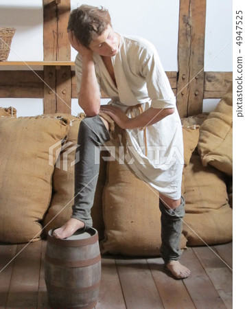 A woman waiting with his feet on a barrel to receive the material of leather goods made by John Shakespeare A woman waiting with his feet on a barrel to receive the material of leather goods made by John Shakespeare 4947525
