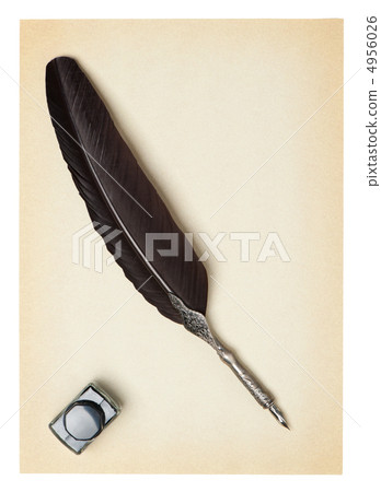 Feather quill and inkwell on an old paper Feather quill and inkwell on an old paper 4956026