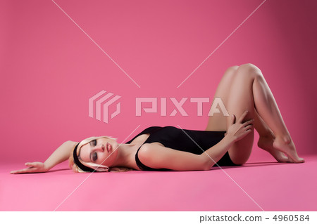 Sexy blond woman sport dress relax on floor 4960584