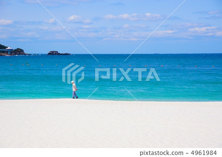 People walking on the beach People walking on the beach 4961984