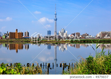 A Tokyo sky tree spreading blue sky and a scenery reflected on the river A Tokyo sky tree spreading blue sky and a scenery reflected on the river 4979837