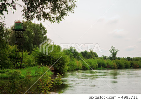calm river with watchtower 4983711