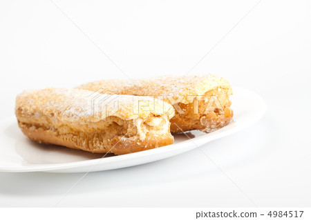 two eclairs on white dish 4984517