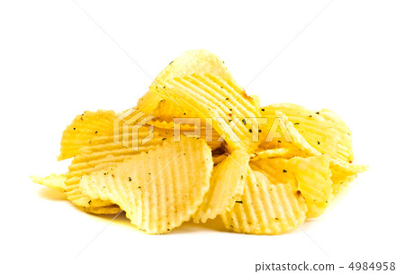 handful of yellow potato chips handful of yellow potato chips 4984958