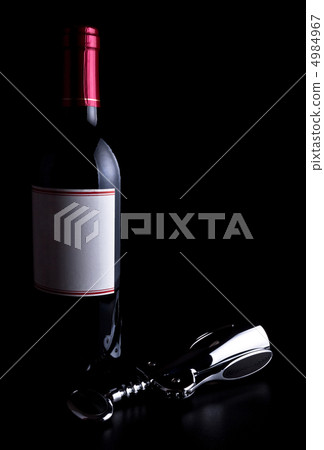 bottle of wine and corkscrew 4984967